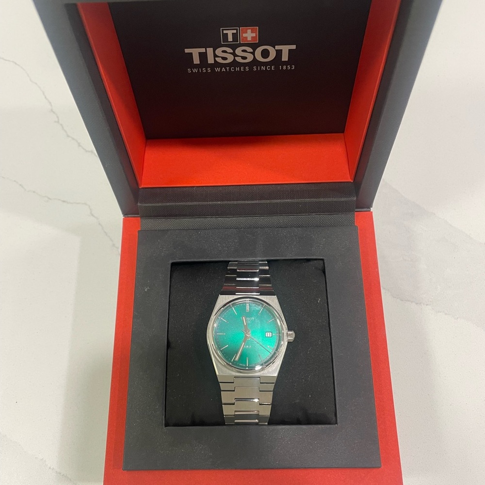 Tissot Silver Watch with Teal Dial